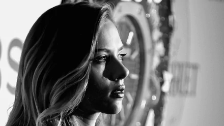 Black and white HD desktop wallpaper featuring a close-up profile of celebrity Scarlett Johansson with dramatic lighting highlighting her face.