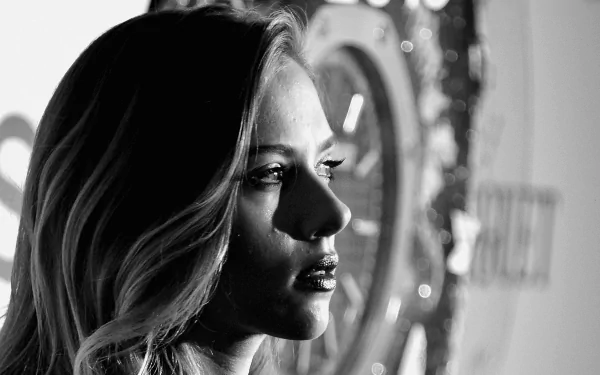 Black and white HD desktop wallpaper featuring a close-up profile of celebrity Scarlett Johansson with dramatic lighting highlighting her face.