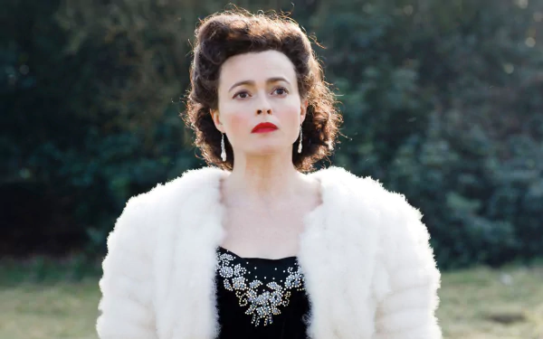 HD desktop wallpaper featuring English actress and celebrity Helena Bonham Carter wearing a white fur coat and black embellished dress outdoors.