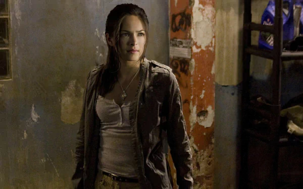 Kristin Kreuk as Chun-Li in a dark, gritty scene from the movie Street Fighter: The Legend of Chun-Li, featured as an HD PC desktop wallpaper.