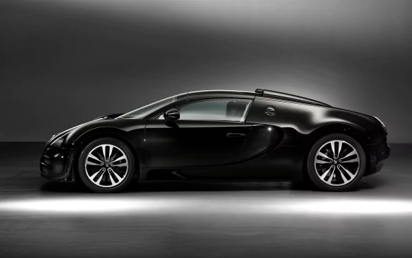 Sleek black Bugatti Veyron Grand Sport Vitesse showcased in a high-definition PC desktop wallpaper, highlighting the vehicle's aerodynamic design and luxury craftsmanship.