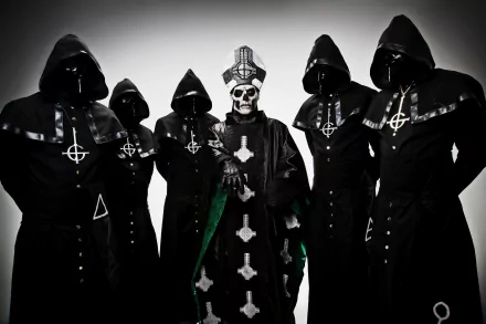 A striking HD wallpaper featuring the Swedish heavy metal band Ghost B.C., showcasing a lineup of masked members in dark cloaks, creating a haunting and theatrical atmosphere.