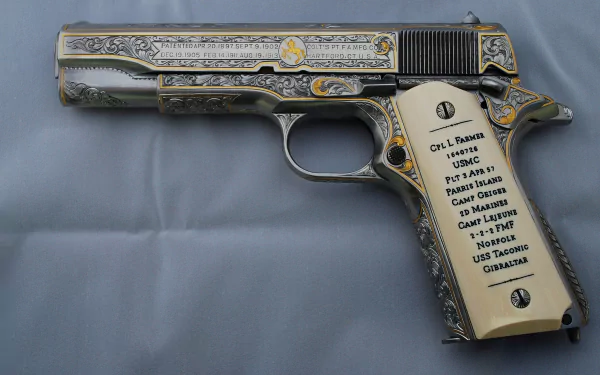 A detailed Colt 1911 handgun showcases intricate engravings and inscriptions, serving as an impressive piece for a man-made HD desktop wallpaper and background.