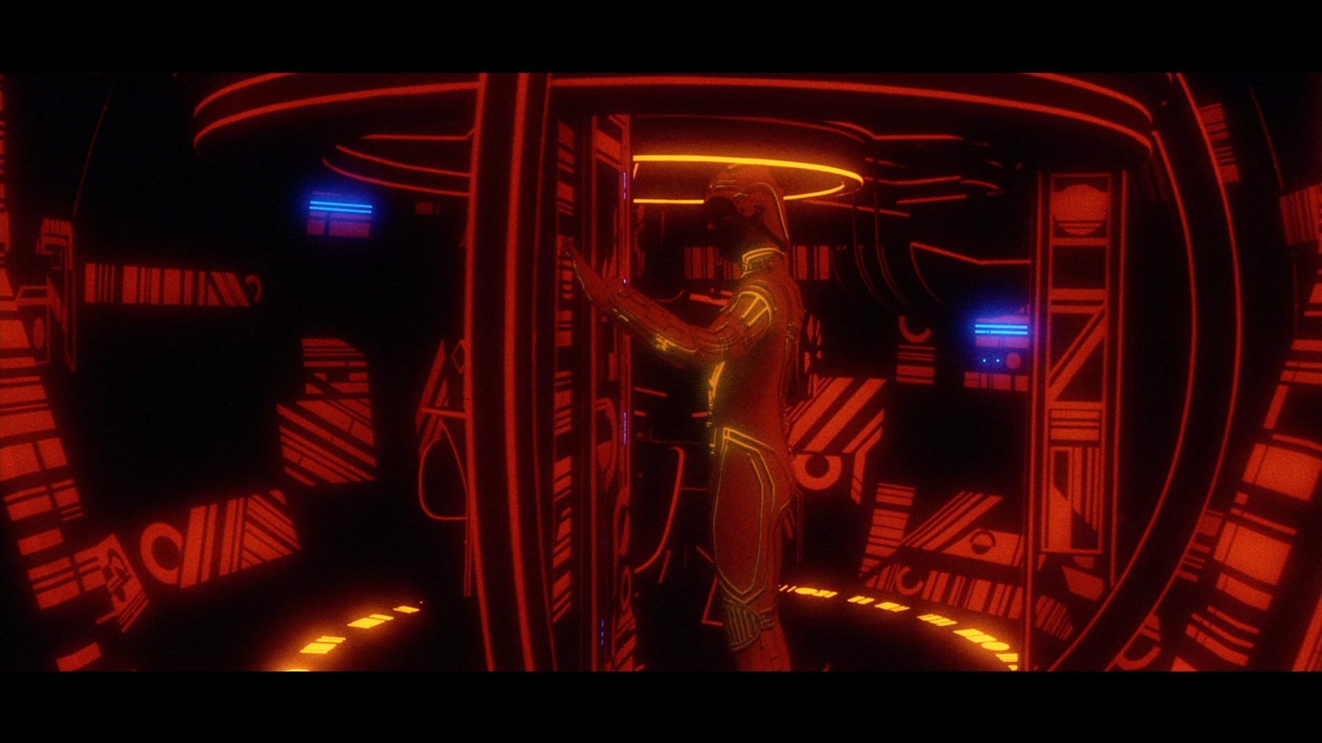 HD PC desktop wallpaper featuring a scene from the movie Tron, showcasing a glowing figure surrounded by neon red and orange lights in a futuristic environment.