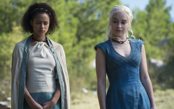 Nathalie Emmanuel as Missandei and Emilia Clarke as Daenerys Targaryen from Game of Thrones, featured in a 4K Ultra HD TV show desktop wallpaper.