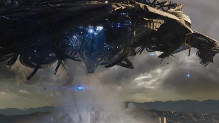 A dramatic scene from *Battle: Los Angeles*, showcasing a massive alien spacecraft hovering over a city skyline, set against a dark, cloudy sky. Ideal as a high-definition desktop wallpaper.