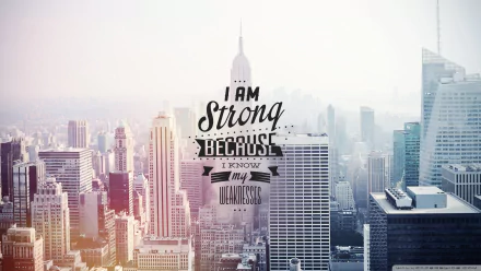 HD desktop wallpaper featuring a city skyline with a motivational quote: I am strong because I know my weaknesses.
