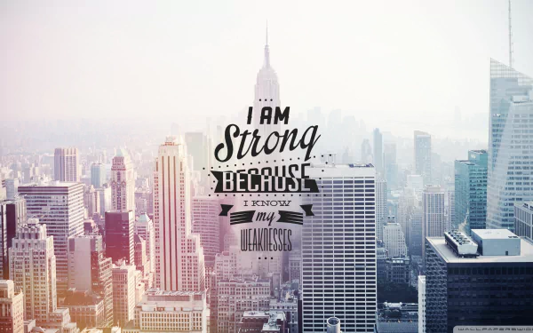 HD desktop wallpaper featuring a city skyline with a motivational quote: I am strong because I know my weaknesses.