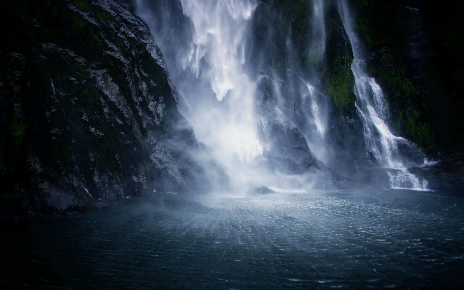 HD PC desktop wallpaper: Stirling Falls cascading down dark cliffs into a misty turquoise pool, a dramatic nature background.