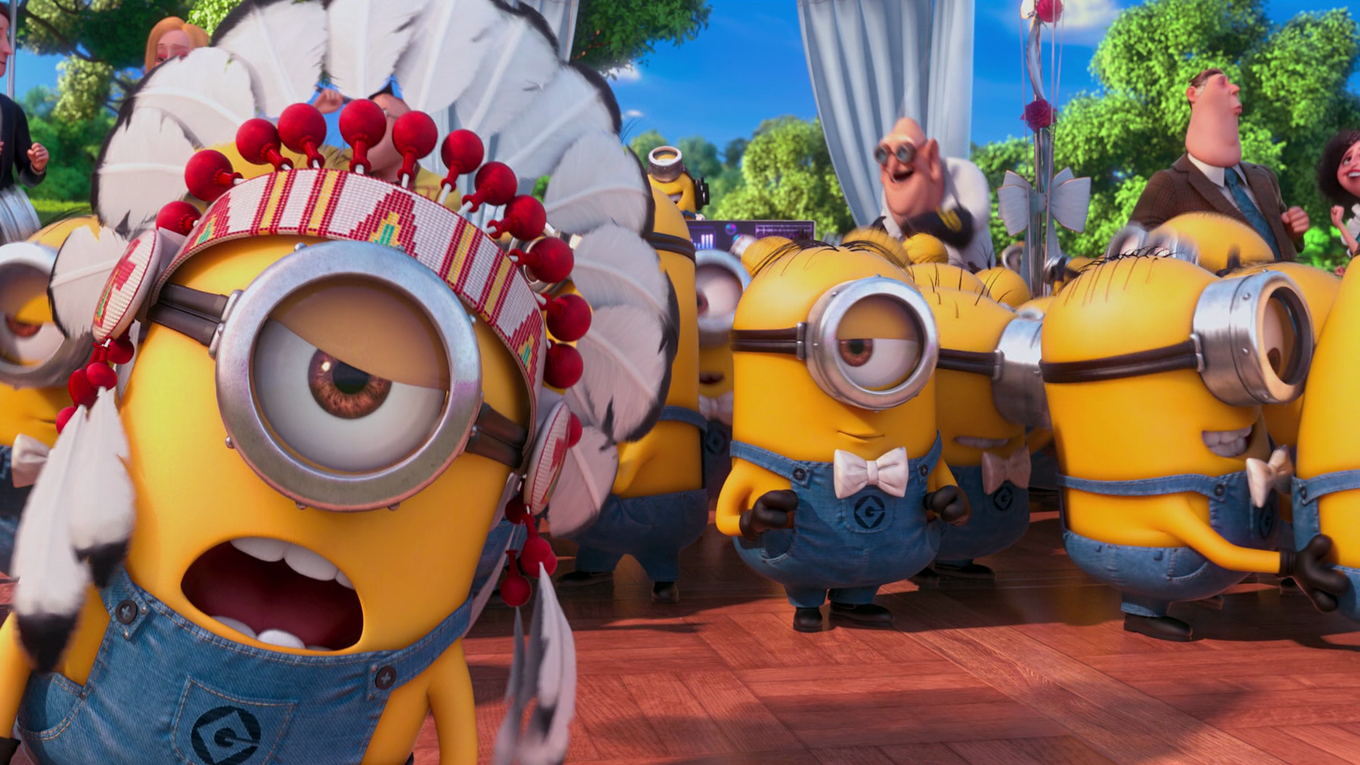 Colorful scene from Despicable Me 2 featuring cheerful Minions in various outfits, set against a vibrant background, creating a lively HD desktop wallpaper and background.