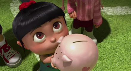 Agnes from Despicable Me holds a piggy bank with wide eyes, set against a vibrant green background. This HD wallpaper captures her charming and playful spirit.