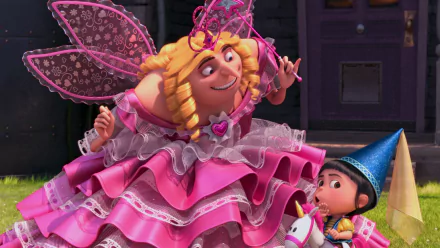 HD desktop wallpaper from Despicable Me 2 featuring Agnes in a blue wizard hat holding a unicorn toy, with Gru dressed as a fairy in a pink dress and wings.