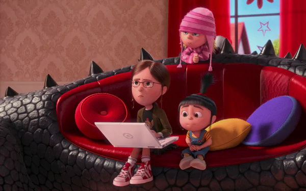 HD PC desktop wallpaper featuring Margo, Agnes, and Edith from Despicable Me 2 sitting on a black dragon-shaped couch in a cozy, colorful room.