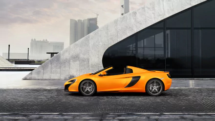 Orange McLaren 650S Spider supercar (vehicle) in side profile parked by a modern concrete building, HD PC desktop wallpaper background.