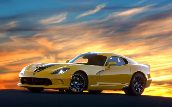Yellow Dodge Viper SRT vehicle parked at sunset with dramatic sky — 2K Quad HD PC desktop wallpaper and background.
