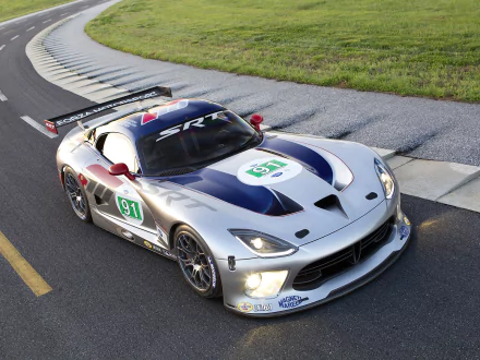 Dodge Viper GTS-R race car in silver and blue livery (#91) hugging a racetrack curb — HD PC desktop wallpaper and background.