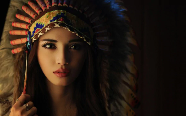 HD desktop wallpaper featuring a woman in Native American cosplay, showcasing intricate headdress details against a dark background.
