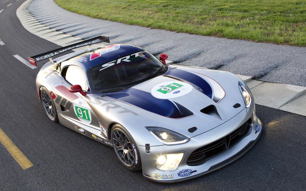 Dodge Viper GTS-R race car in silver and blue livery (#91) hugging a racetrack curb — HD PC desktop wallpaper and background.
