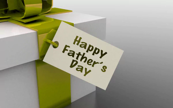 A HD wallpaper featuring a gift with a green ribbon and a tag that reads Happy Father's Day.