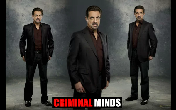 HD wallpaper featuring a character from the TV show Criminal Minds, showcasing a man in a black suit against a neutral backdrop with bold text below.