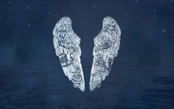 A mesmerizing HD wallpaper featuring ethereal wings, inspired by Coldplay's music, set against a serene night sky and tranquil water backdrop.
