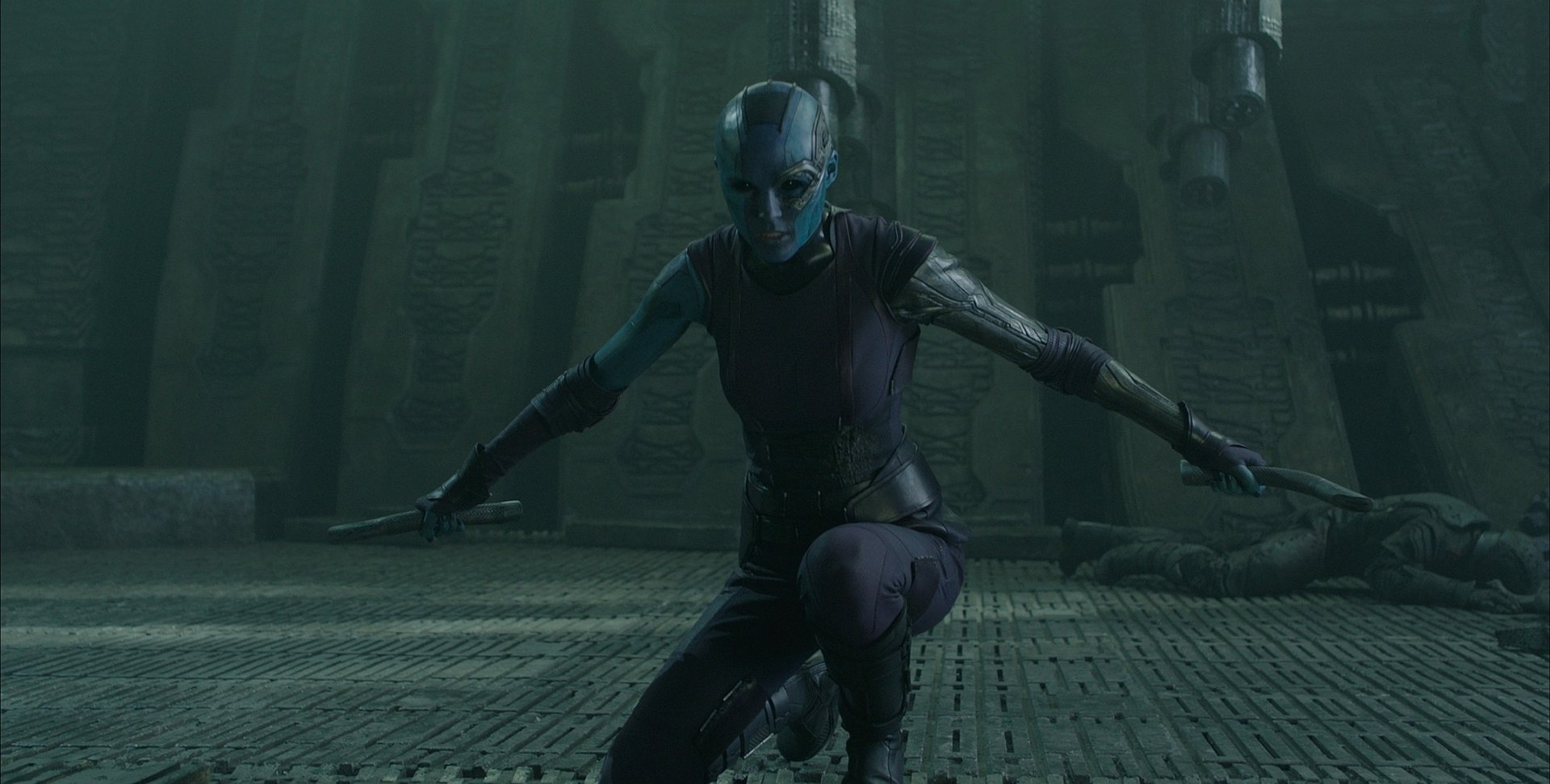 Nebula (Marvel Comics) from Guardians of the Galaxy movie crouches in a dim alien ruin — HD PC desktop wallpaper/background.