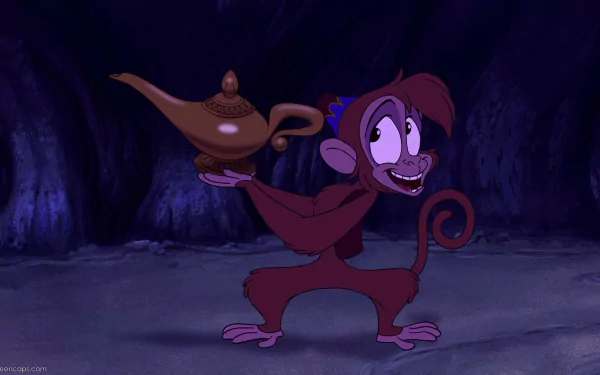 HD PC desktop wallpaper of Disney's Aladdin video game: Abu the monkey grinning and holding the magic lamp in a dim cave, vibrant colors and animated style.