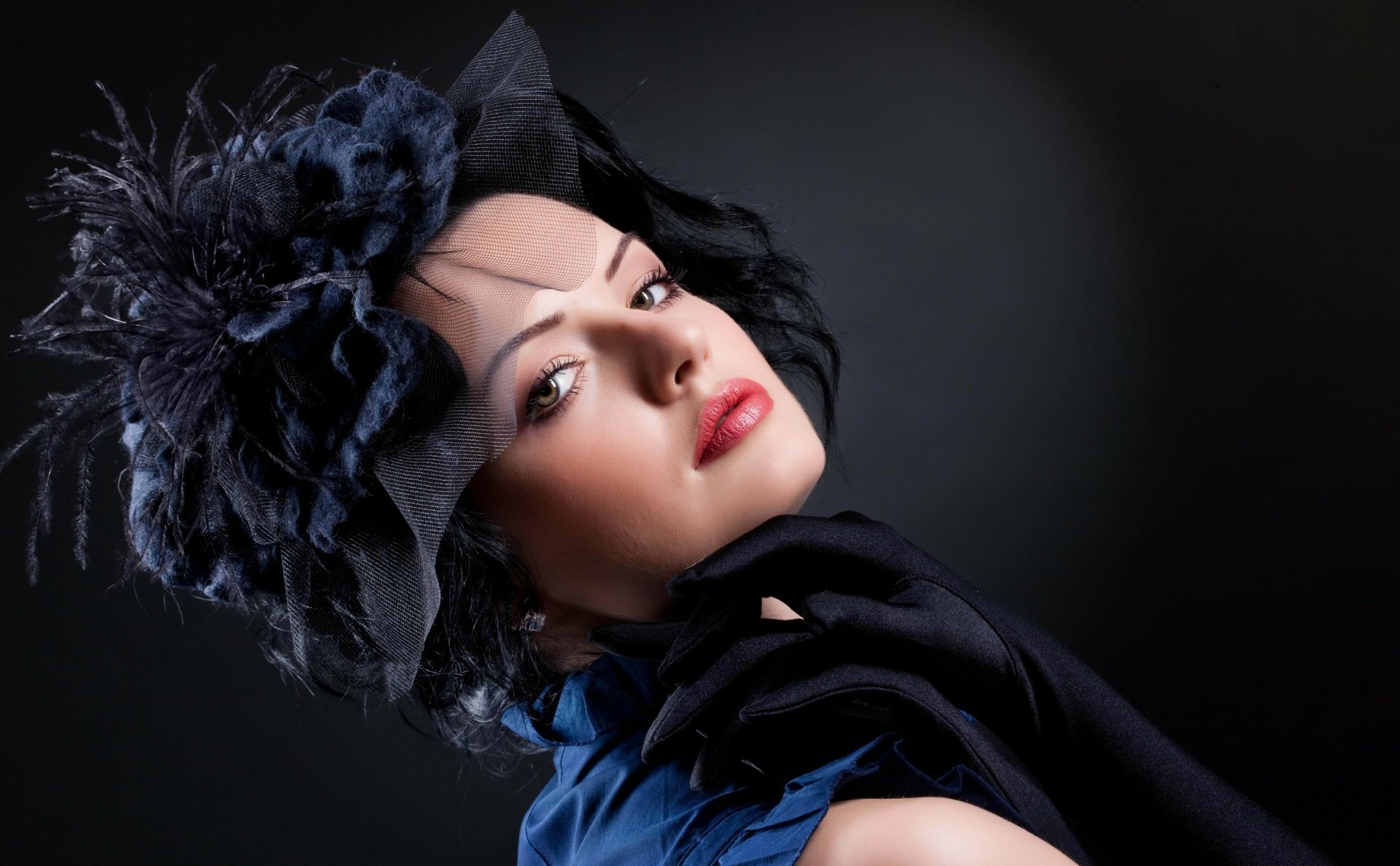 HD PC desktop wallpaper featuring a close-up portrait of a woman with an elaborate black headpiece and glossy red lips against a dark background.