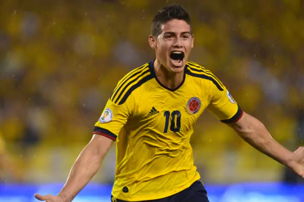 HD wallpaper of a thrilled soccer player in Colombia's yellow jersey, number 10, with a celebratory expression during a match.