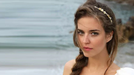 A Spanish model, Clara Alonso, poses gracefully by the water, showcasing her natural beauty in this HD desktop wallpaper.