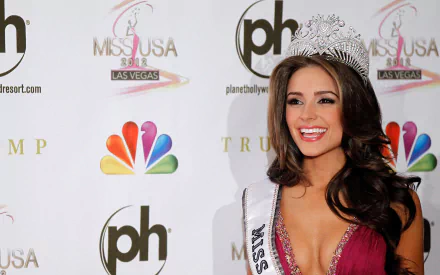 HD desktop wallpaper featuring American model and celebrity Olivia Culpo wearing a crown and sash at the Miss USA Las Vegas event.