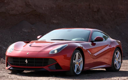A red Ferrari F12berlinetta parked on a rocky terrain, showcased as an HD PC desktop wallpaper and background.