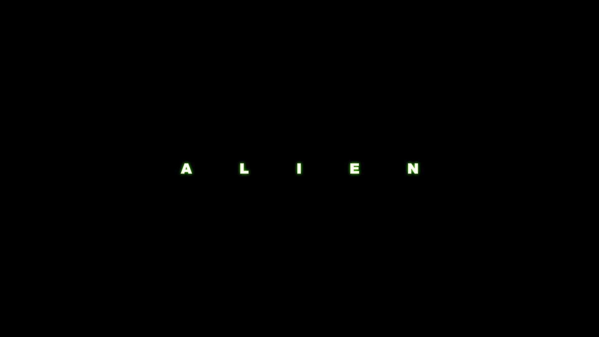 Minimalist HD PC desktop wallpaper featuring the green glowing title ALIEN from the movie on a black background.