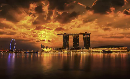 Sunset over Singapore's Marina Bay Sands and ArtScience Museum, golden clouds mirrored in the bay — HD PC desktop wallpaper of a man-made waterfront skyline.