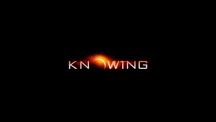 HD PC desktop wallpaper featuring the movie Knowing title with a stylized orange crescent integrated into the text on a black background.