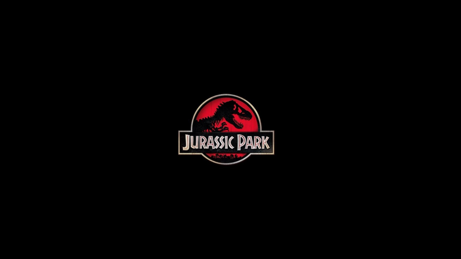 HD PC desktop wallpaper featuring the iconic red and black Jurassic Park movie logo on a solid black background.