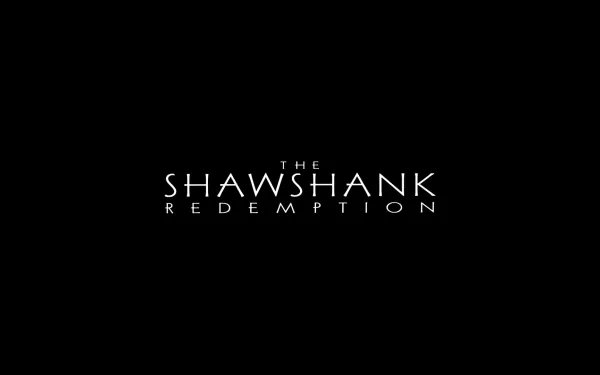 A sleek HD wallpaper featuring the title of the movie The Shawshank Redemption against a black background, capturing the essence of this iconic film.