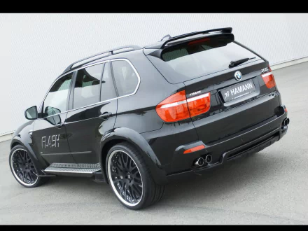 HD desktop wallpaper featuring a sleek black Hamann BMW X5 showcasing its sporty design and custom detailing.