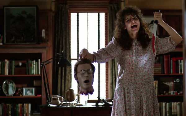 HD PC desktop wallpaper featuring a scene from the movie Beetlejuice, showing a woman holding a severed head in a dimly lit room.