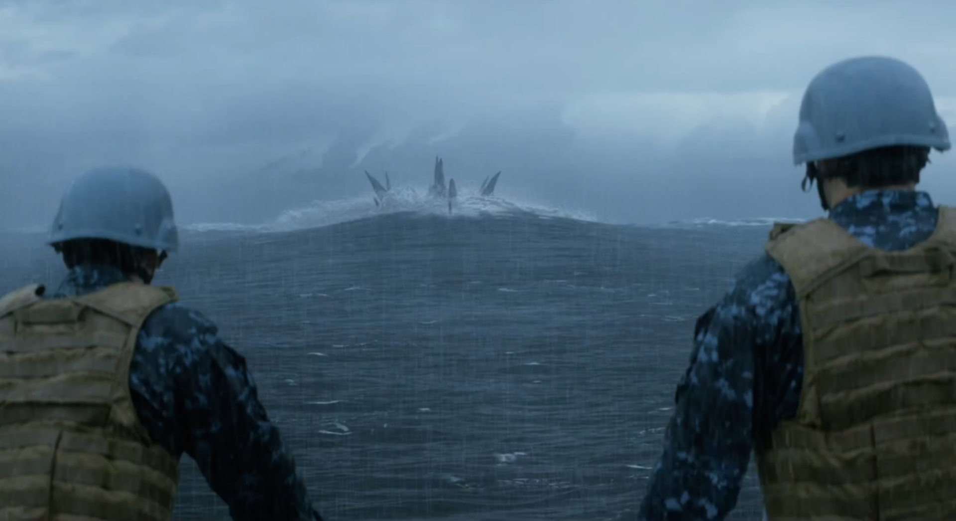 HD PC desktop wallpaper featuring a scene from the 2014 movie Godzilla with soldiers observing the ocean and Godzilla emerging in the distance.