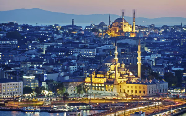 A stunning HD desktop wallpaper showcasing Istanbul at dusk, featuring illuminated mosques and the vibrant skyline, capturing the city's rich architecture and atmosphere.