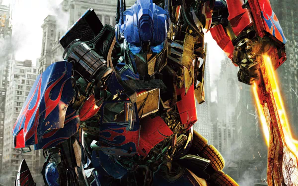 An HD desktop wallpaper featuring Optimus Prime from Transformers: Dark of the Moon, showcasing his detailed armor and iconic sword against a city backdrop.