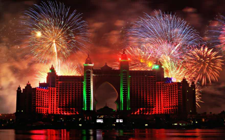Fireworks illuminate the night sky above the Atlantis, The Palm hotel in Dubai, creating a vibrant and colorful display over the iconic man-made island.
