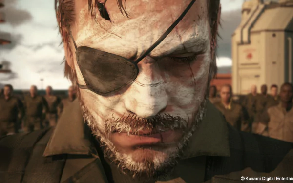 HD wallpaper featuring a close-up of a character from Metal Gear Solid V: The Phantom Pain, showcasing intense expression and iconic eye patch amidst a military backdrop.