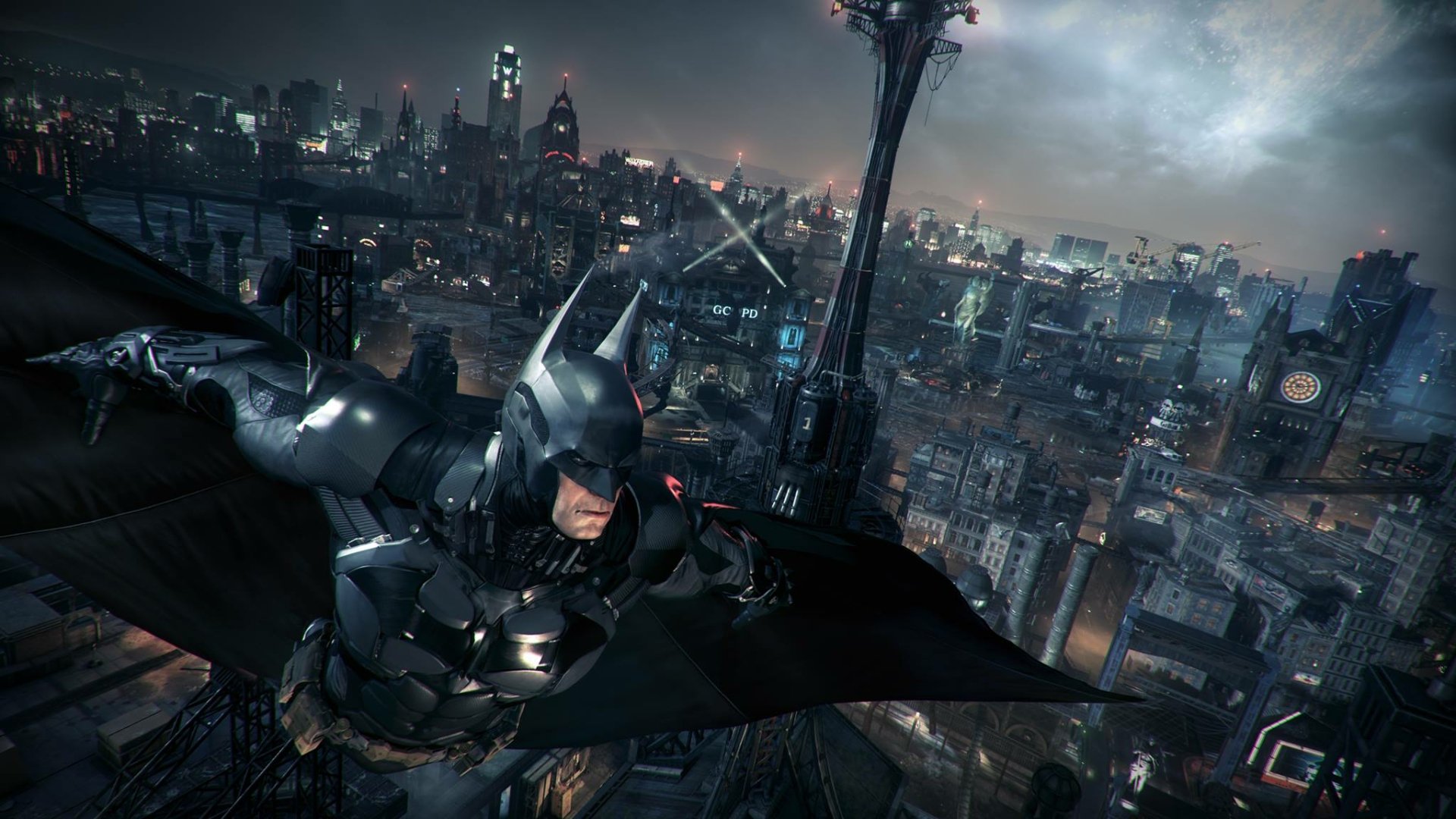 HD PC desktop wallpaper/background: Batman gliding over rainy Gotham at night — cinematic screenshot from the video game Batman: Arkham Knight.