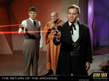 HD PC desktop wallpaper from the TV show Star Trek: The Original Series — Captain Kirk and Spock aim phasers while a robed man stands behind them.
