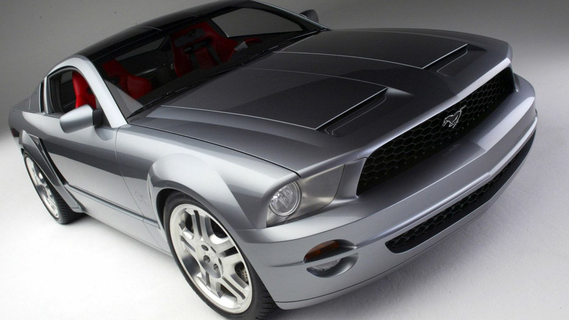 HD PC desktop wallpaper featuring a sleek silver car from the video game Need for Speed: Carbon, showcasing detailed design and dynamic racing aesthetics.