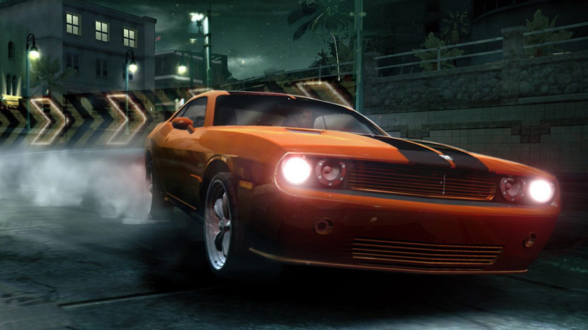 HD PC desktop wallpaper featuring a sleek orange muscle car drifting at night in the video game Need for Speed: Carbon.