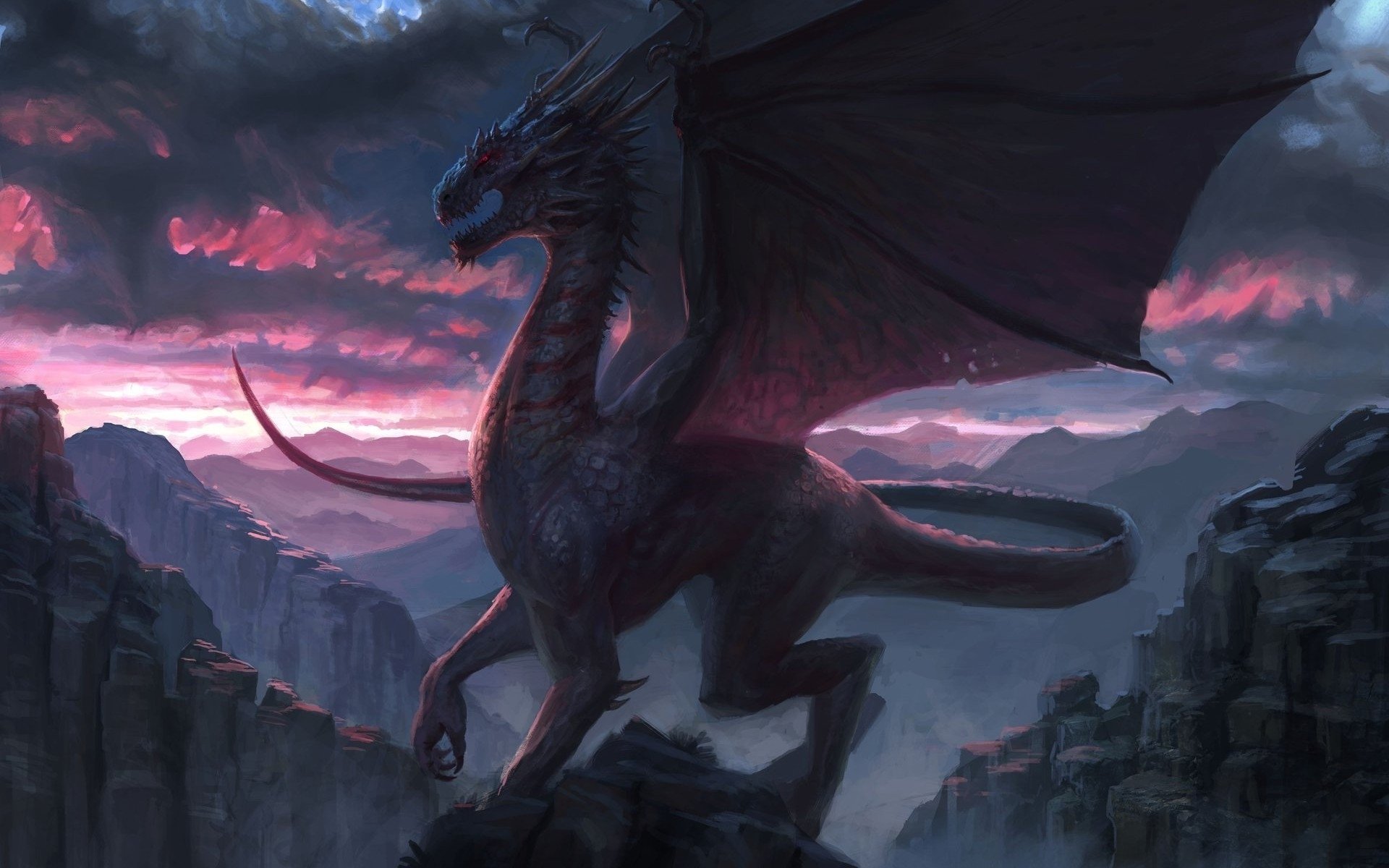 HD fantasy desktop wallpaper depicting a majestic dragon perched on rocky terrain against a dramatic sunset sky.