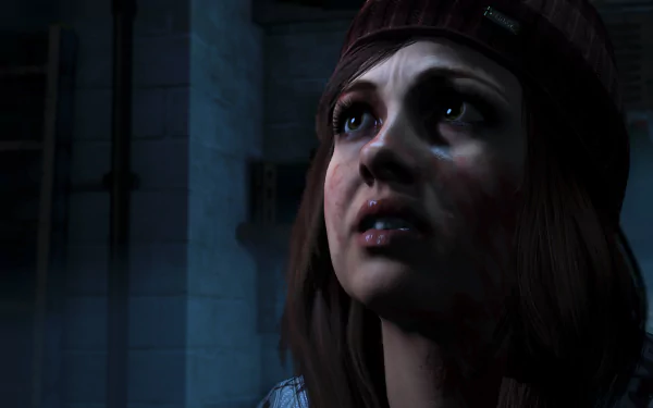 HD PC desktop wallpaper/background: a blood-smudged young woman in a beanie from the video game Until Dawn, gazing upward in dim, icy surroundings.